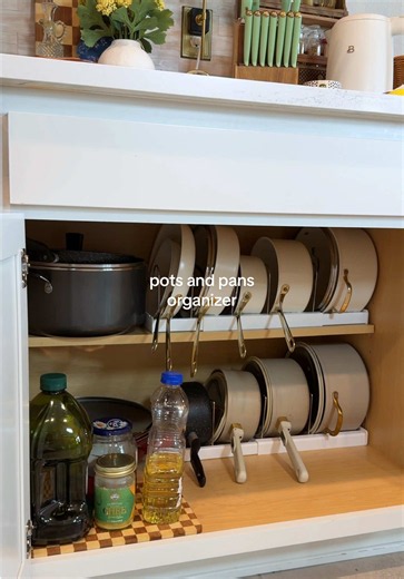 If you store your pots and pans in the oven, this organizer gives you a place to keep them separated and easy to grab without unloading the oven every time you use it 🧡 #potsandpansorganization #cookwareorganization #kitchenorganization #organizedkitchen #tiktokshopcreatorpicks