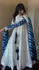 16K views · 6.6K reactions | Product Details ✨ Fabric: Premium cotton Design: Navy blue thread embroidery with small floral motifs Style: Wrap-style anarkali with tassels Sleeves: Full embroidered sleeves Bottom: Cotton pant Dupatta: Blue & white printed chiffon dupatta | The Arabian Avenue | Facebook