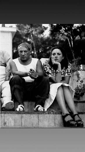 Dora maar and Picasso 🎨 Dora Maar & Pablo Picasso: the love that felt like drowning in light She was 28, luminous, terrifyingly alive. He was 54, a sun that burned everything it touched. They met in the winter of 1935–36 at the Café Les Deux Magots. She sat alone, playing the knife game—slamming the blade between her spread fingers, missing sometimes on purpose, letting tiny roses of blood bloom on her black gloves. When he asked for the gloves, she gave them without a word. Something in her al