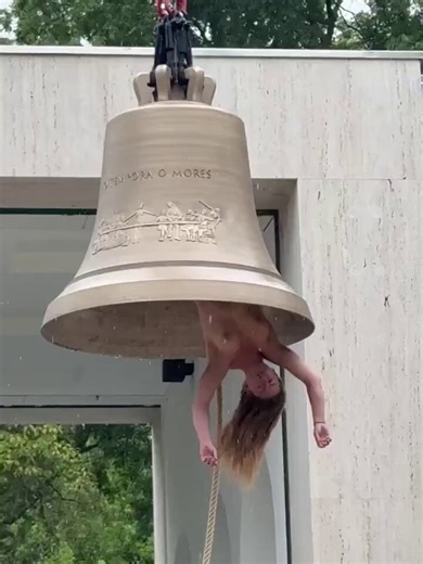 Video from the Austrian pavilion at the Venice Biennale: Artist Florentina Holzinger hangs upside down inside a giant bronze bell. She swings back and forth and literally “rings” the bell with her own body.This is part of a large-scale installation about the climate apocalypse. The bell with a person inside symbolizes a warning about the coming flood.The Biennale officially opens on May 9, 2026, but the performance has already begun.