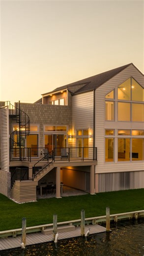Gnome Architects on Instagram: "Kinfolk House l & ll sit side by side along one of South Bethany Beach’s many canals. Each house takes on its own unique identity while sharing a material palette of terrazzo tile, cedar shake siding, and contemporary wood cladding. Check out these two homes from above and check back as we go inside each house to explore the modern coastal interiors."