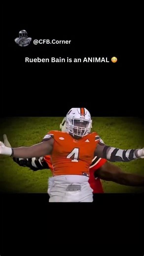 College Football on Instagram: "Rueben Bain Jr. is a defensive lineman whose emergence has been defined by explosiveness, maturity, and immediate impact well beyond his age. Stepping onto the field with confidence, Bain quickly established himself as a disruptive force, combining power, quickness, and an advanced understanding of leverage to overwhelm blockers. Known for his relentless motor and ability to collapse pockets, he consistently affects games even when he isn’t filling the stat sheet.