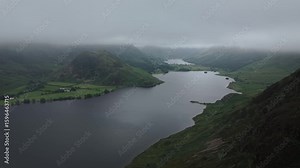 Crummock Water lake in the mountains of Lake District UK in wet weather