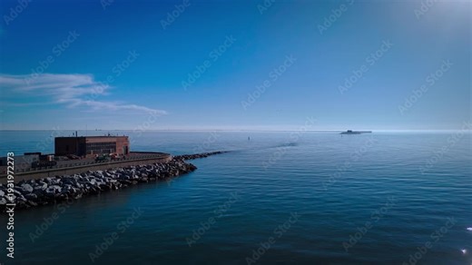 Aerial cinematic view of the Chesapeake Bay Bridge-Tunnel trestle and island in the Hampton Roads region of Virginia