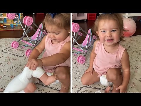 Little girl hilariously gags while changing doll's diaper #shorts
