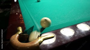 Playing russian billiard in a poolroom