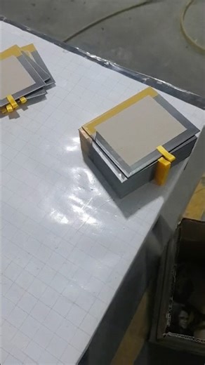 Automatic application of ribbon on flat leather case. #ribbonpastingmachine #ribboninsertingmachine
