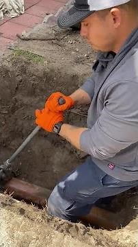 Plumber Cuts A Clay Sewer Line