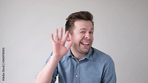 Goofy man appearing on screen and waving his hand in hello gesture.