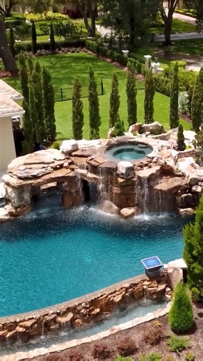 Who doesn’t love a natural rock grotto? Transforming backyards into a total paradise and creating mesmerizing custom pools is simply part of the job for our passionate team. #insanepools #lucaslagoons #pool #backyard | Lucas Lagoons Design
