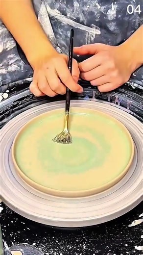 Color flows slow—green bloom spreads across morning clay, wheel whispering in soft rotation