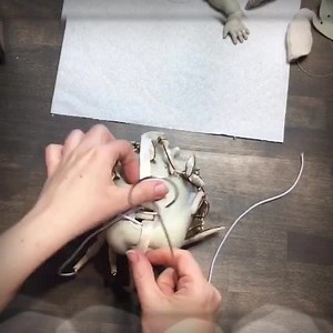 6.8K views · 439 reactions | The process of attaching clay head and chest plate to cloth torso. This doll has a slightly different torso. I wanted to try and make a doll that could sit on it own, for that to happen the torso had to have a heavy wide flat bottom to counterweight the large head. #darkalleydolls #artdollprocess | Dark Alley Dolls | Facebook