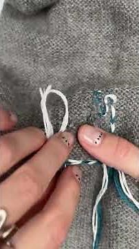 How do you weave in your tail threads once you've finished a darn?
