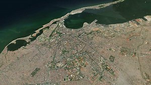 Satellite Luanda map background loop. Spinning around Angola city air footage. Seamless panorama rotating over downtown backdrop.