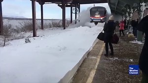 4.4M views · 69K shares | That's quite the arrival! Watch as this train barrels through fresh snow from Winter Storm Stella, totally covering onlookers | The Weather Channel | Facebook