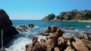 Indulge in the natural beauty of Cala San Francesc, where the azure sea meets the lush vegetation, offering a tranquil escape.