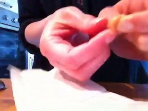 Breaking open a cyst sac