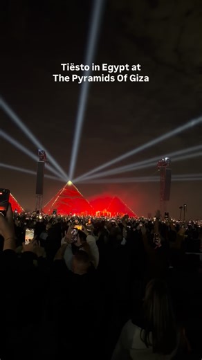 Cairo Spots on Instagram: "Tiësto is live at the Pyramids of Giza. Classic after classic keeps rolling, with the crowd singing along and the energy staying high from drop to drop. The pyramids light up the background as the Giza Plateau turns into one massive shared moment, built on tracks that defined a generation of electronic music. A night driven by pure nostalgia and scale, unfolding right now under the pyramids. Follow @cairospots, visit our website cairospots.com and download our Cairo Sp