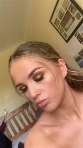 Doing your makeup yourself for it to be more natural and end up with glitter eye lids and blue water line