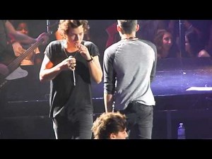One Direction - Back For You - Harry eats lollipop thrown on stage - Toronto July 9th, ACC