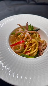 1.6K reactions · 34 shares |  Spicy Baby Calamari Pasta! 撚✨ Sautéed onion, garlic, fresh red pepper, cherry tomatoes, and tender baby calamari tossed with parsley in olive oil — all served over perfectly cooked spaghetti. A fiery, flavorful seafood delight! ️龍暈 #spicycalamaripasta #foodie #comfortfood #pasta #seafoodlovers #romanticdinner | Hashmi cuisine | Facebook