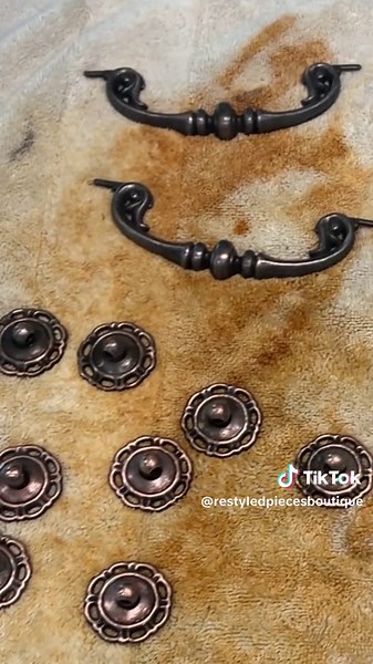 This is how I am reviving the hardware on my latest furniture makeover. This process gets the hardware clean and sometimes I love the result. Other times, not so much! But, I always have a secret weapon in my @Rust-Oleum gold spray paint. It never fails me! Stay tuned for the final reveal of my latest project! #cabinethardware #cleaninghardware #hardwaresoup #furnituremakeovers #diy #furnitureflips #diytips