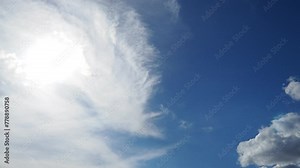Atmospheric phenomena. Sky background. The sun peeks through the foggy haze. The clouds fly away, leaving a clear sky. Weather forecast. Climate change. Spring or summer sky
