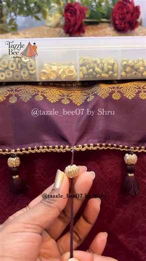 Tazzle Bee by Shru... on Instagram: "Beautiful Hanging Tassels Tutorial 🌼6 strands used for tying each bead & tassel. 🌼Total 400 cotton threads used for tassels ( you can use silk threads too) 🌼Beads can be of your choice 🌼Length of tassels is customizable 🌼Gap between tassels as per preference, 2.5 inches gap kept due to big beads. (closer may look heavy) 🌼Zari thread used for tying threads."