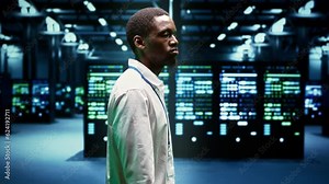 IT admin walking in server farm performing data backups and providing centralized storage. Serviceman debugging Uninterruptible Power Supply ensuring operational continuity