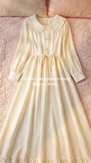 Cream Cottagecore Long Sleeve Dress. A soft feminine maxi dress designed for effortless elegance. The textured bodice with delicate buttons and Peter Pan collar gives a charming vintage touch, while the flowing chiffon skirt drapes beautifully for a graceful silhouette. The adjustable waist ribbon allows a flattering fit, perfect for casual outings, brunch dates, or a dreamy cottagecore look. • Soft chiffon blend fabric • Elegant Peter Pan collar • Decorative front buttons • Adjustable waist rib