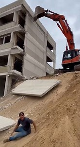 Collapsing Wall Nearly Strikes Man During Building Demolition A close call was caught on camera during a building demolition when a collapsing wall narrowly missed a man standing nearby. The incident occurred at a controlled demolition site in East Harbor District, where crews were tearing down an old structure slated for redevelopment. Video shows a section of wall falling outward unexpectedly, forcing the man to quickly run clear as debris crashed to the ground just feet away. Officials confir