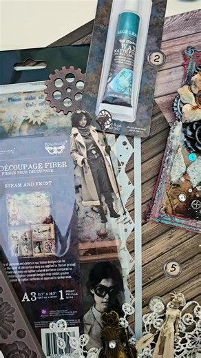 Oh lala… this Steam & Frost goodness!!! 💙@Tanya Scrap built two gorgeous mixed-media frames using the Redesign Antique Gaze Mould, Finnabair’s Steam & Frost découpages, and all the matching ephemera pastes & waxes. Layers of gears, wings, numbers, flowers, textures .... they just look amazing together! This is exactly why we love this collection! 💙🖤 | Prima Marketing Inc.