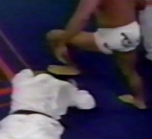 Fighter ends the fight with a stomp on his opponent's head.