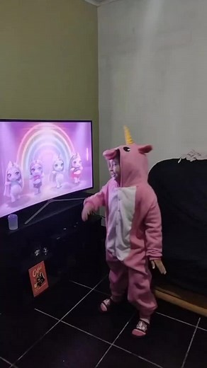 Child Dances in Unicorn Onesie: Adorable Moments