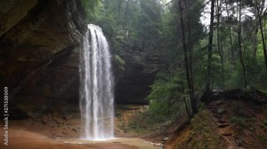 Ash Cave Falls Loop - Ash Cave, an enormous recess cave in the Hocking Hills of Ohio, is graced by a plunging waterfall in this seamlessly looping footage.