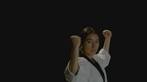 Young woman throws karate punches to the camera - Free Stock Video