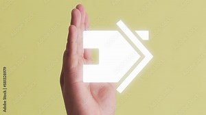 Symbol of a house appearing on a hand. Yellow background. Vertical shot.