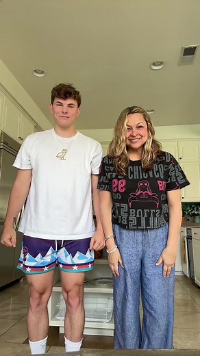 Synchronized Dance Routine in a Stylish Kitchen