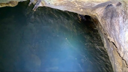 They Crawled Through an Icy Water Tunnel and Discovered a Sparkling Cave
