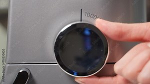 Close up of the power boost button on a stand mixer or food processor. Increasing in the mixer's speed and power for more efficient mixing or processing. Switching between turbo modes on equipment