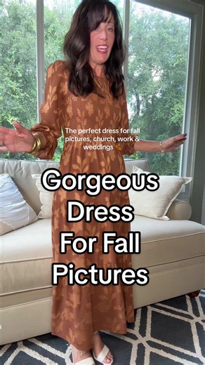 The prettiest rust floral midi dress for fall! 🍂 This flowy long-sleeve dress is perfect for fall family pictures, church, work, weddings, or any special occasion. I love how the flattering, flowy fit gives you plenty of room through the tummy area without sacrificing style. It also comes in several beautiful colors, but this rich rust shade is absolutely gorgeous for fall! 🤎 #FallDress #FallWeddingGuestDress #ChurchDress #FallFamilyPictures #FloralMidiDress