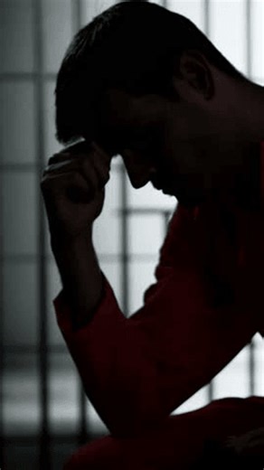 Prisoner Behind Bars In Jail Cell. Crime Punishment And Criminal Justice