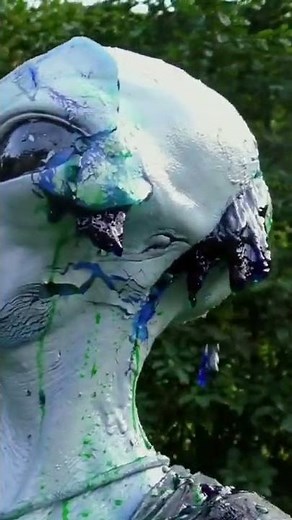 slime is pouring out of the grey alien head