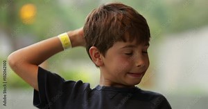 Young child acting goofy in front of camera. Child clown acting out in funny expressive manner in front of viewer in 4k