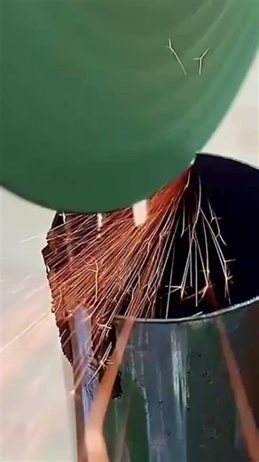cutting the top edge of metal pipe to create many thin vertical slots using a laser welding machine