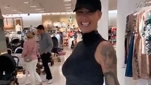 Amber Rose looks stunning with her baby bump in a black dress