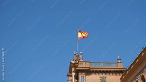 Spanish flag waving over bright sky background, spain national sign symbol,4k
