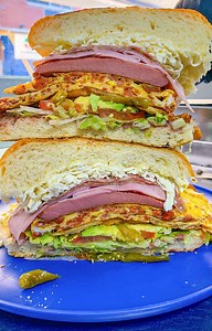 1.7M views · 43K reactions | Galdino Molinero and his wife Lilia run Tortas Neza, a food truck in Corona, Queens that sells massive tortas. Relatively inexpensive at around $11, these Mexican sandwiches are are stuffed with avocado, refried beans, jalapeños, cheese, and loads of meats like chicken, ham, and sausage. | Munchies | Facebook