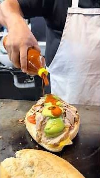We’re at Tortas Richard, making a mega torta in Guanajuato. 🤯 Would you try it? 🤷🏽‍♂️