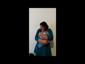 Joyful hugging of balloons